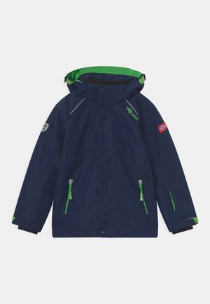 Navy blue children's rain jacket featuring a green hood lining, reflective accents, and green zippered pockets. Includes a patch with a flag.