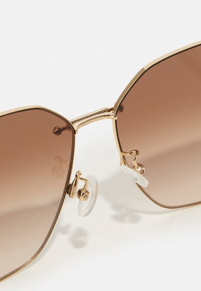Alexander McQueen Slnečné okuliare - gold/brown