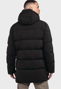 Schöffel URBAN STYLE CERS - Daunenmantel - schwarz