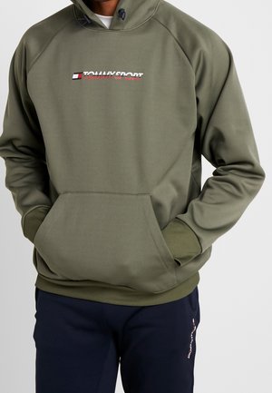 Felpa verde oliva con tasca frontale, cappuccio regolabile con coulisse e logo "TOMMY SPORT" ricamato. Presenta polsini e orlo a costine.