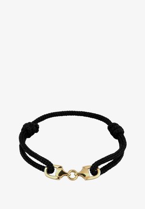 Sort flettet snorarmbånd med guldfarvet metalbeslag forbundet af en lille ring, der danner en rund form.