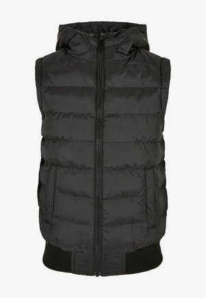 Črni napihljivi brezrokavnik s kapuco, spredaj z zadrgo in stranskimi žepi. Ima prešite dele in rebrast rob za dodatno teksturo.