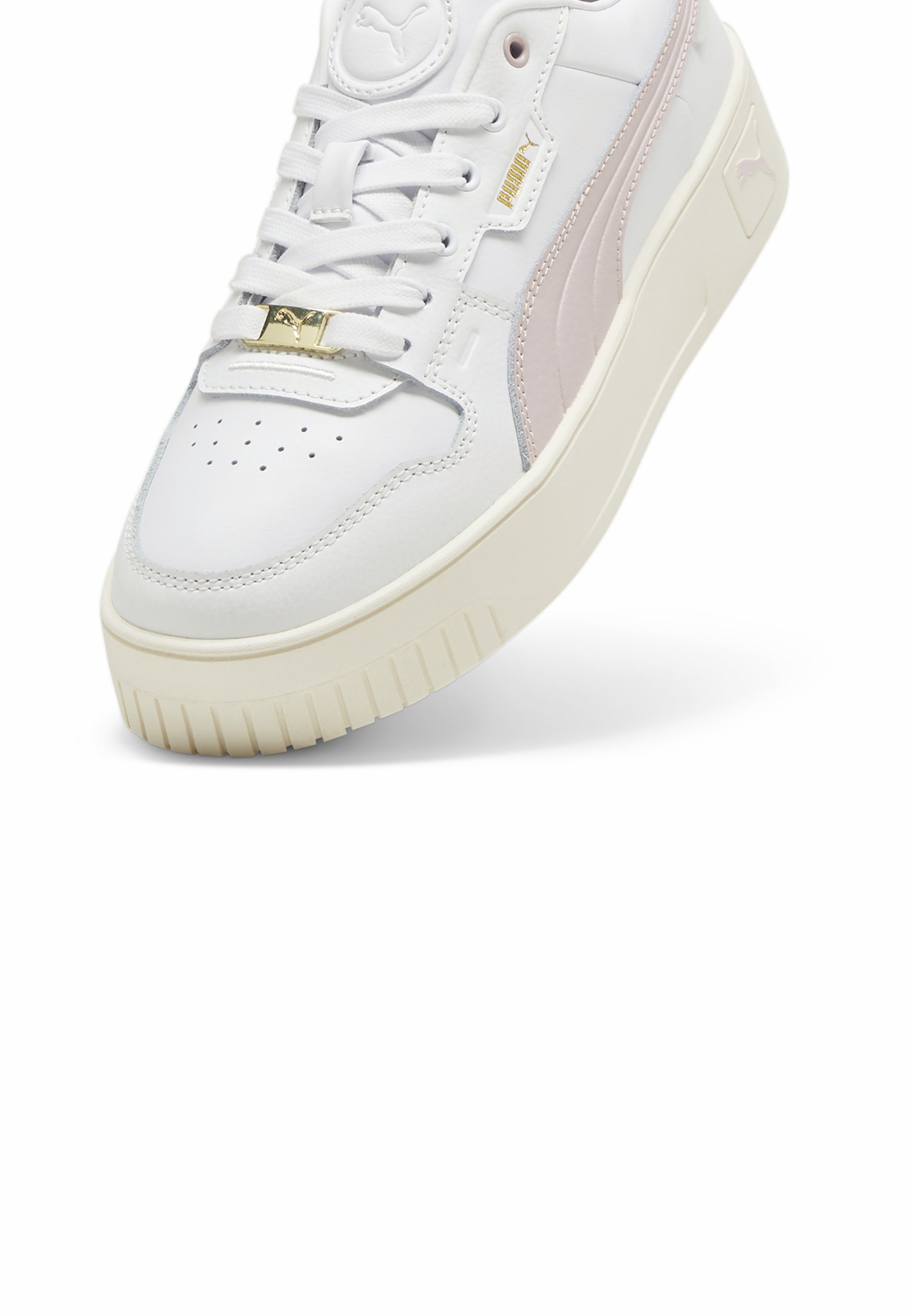 gold and white puma sneakers