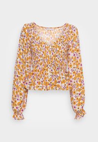 Blusa floral com corpo franzido, mangas longas bufantes e bainha cropped. Apresenta um padrão de flores laranja e rosa sobre um fundo claro.