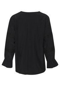 Blusa nera con maniche lunghe e polsini elasticizzati, dettagli in pizzo sulle maniche e scollatura arrotondata. Tessuto liscio e vestibilità comoda.