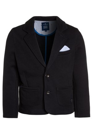 Schwarzer Strickblazer mit Reverskragen, zwei Fronttaschen und weißem Einstecktuch. Verfügt über einen Knopfverschluss und ein blau gemustertes Futter.