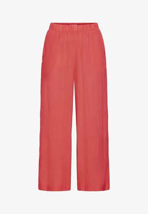 Platīši bikses dzīvīgā koralju krāsā, izgatavotas no teksturēta auduma ar elastīgu jostasvietu komfortam. Bez kabatām.