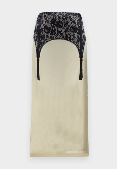 Csipkés bodyn a fekete virágos csipke felső és bézs selyem alsó résszel, állítható fekete pántokkal és bojt díszítéssel. Klasszikus sziluett.