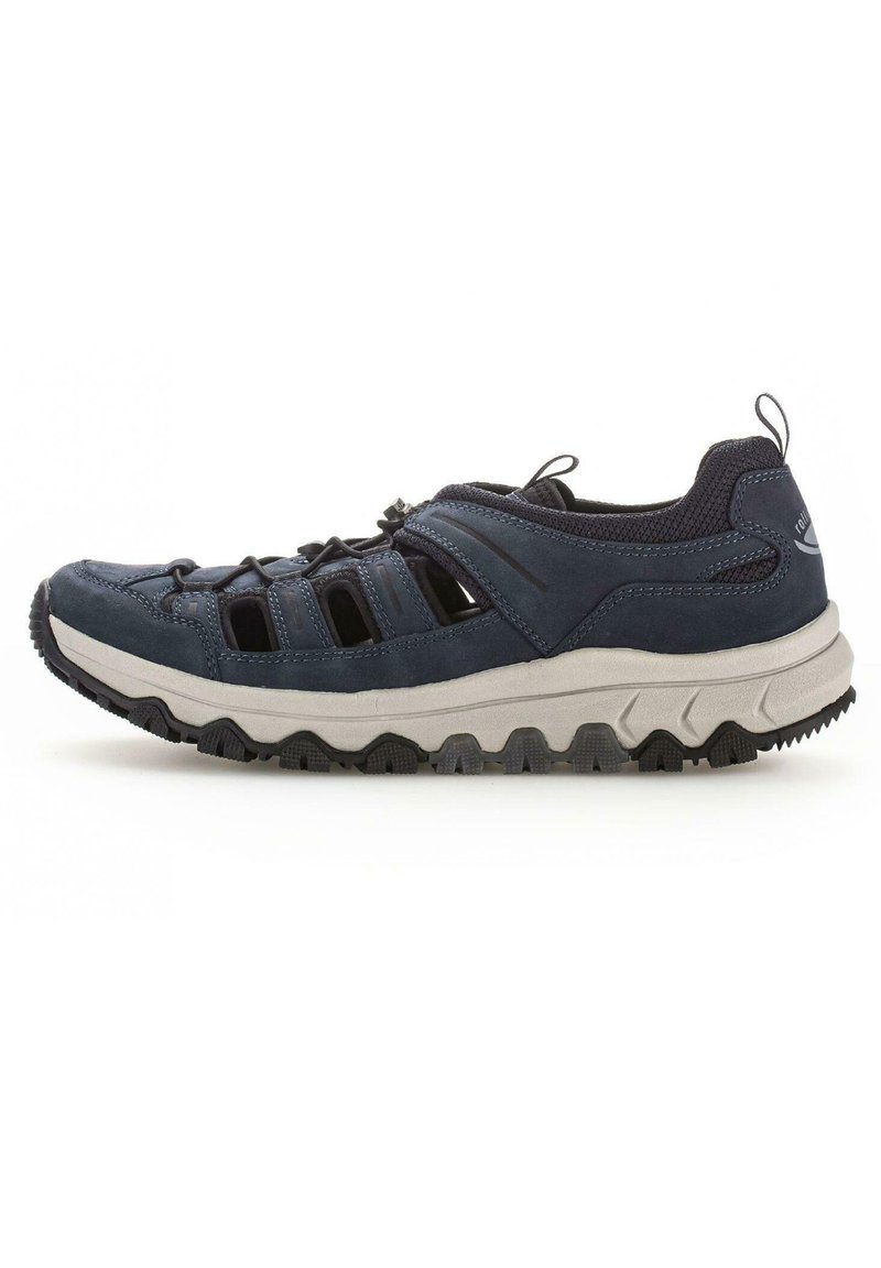Navy blue athletic shoe with mesh and suede upper, rubber sole featuring a textured grip, and elastic laces for a secure fit.