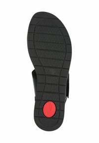Suola di sandalo nera in gomma testurizzata per una migliore aderenza, con un accento circolare rosso etichettato "comfort" e un motivo di forme esagonali.