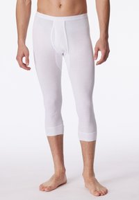 Sous-vêtement long blanc à côtes avec un design ajusté, jambes courtes et une ouverture à l'avant. Le matériau semble doux et flexible.