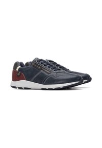 Zapatillas de cuero azul marino con acabado texturizado, detalles en gris, un zipper lateral y suelas blancas con patrones de agarre de goma.