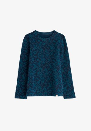 Tamsiai mėlyna ilgomis rankovėmis maikutė su šviesiai žaliais lapų raštais. Apvalus iškirpimas ir šiek tiek tekstūruotas audinys. Laidūs ir patogūs.