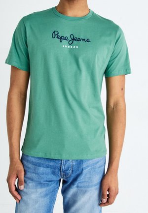 Grøn bomulds-T-shirt med rund hals og korte ærmer. Har "Pepe Jeans London" broderet i marineblåt på forsiden.