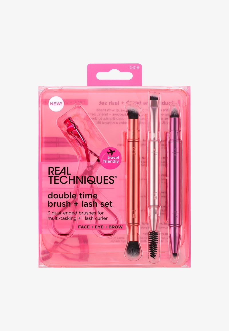 Travel-friendly Real Techniques set with three dual-ended makeup brushes and one eyelash curler in transparent pink packaging.