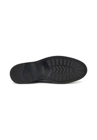 Suola in gomma nera con battistrada a motivo e finitura testurizzata; include il marchio "Clarks" vicino al tallone, progettata per trazione e durabilità.