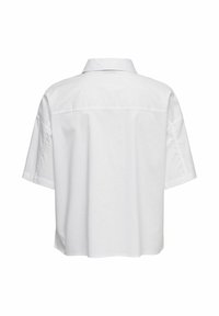 Vue de dos d'une chemise blanche uni à manches courtes, avec col et coupe ample, présentée sur fond blanc.