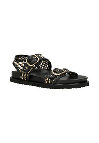 Schwarze geflochtene Sandalen mit einem Muster, die zwei verstellbare Riemen und metallische Schnallen auf einer schwarzen flachen Sohle verfügen.