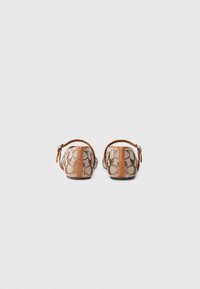 Two backs of shoes featuring a brown and beige patterned material with an orange strap. The design includes a textured finish and sleek shape.
