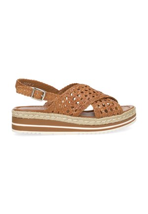 Sandale en cuir tressé marron avec bride à la cheville, semelle plateforme et détails en corde le long de la semelle intermédiaire, vue de profil latéral.