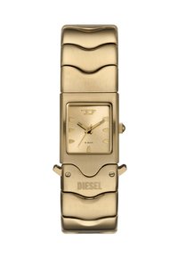 Quadratische goldene Metall-Uhr mit einem strukturierten, wellenförmigen Armband, minimalistisches Ziffernblatt mit goldenen Stundenmarkierungen und einem auffälligen 'DIESEL'-Logo am Verschluss.