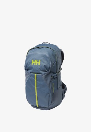 Blauwe outdoor rugzak met gele accenten, voorvak met ritssluiting, compressieriemen aan de zijkant en gevoerde rugondersteuning, gelabeld "Generator 20".