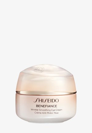 Crème contour des yeux lissante anti-rides Shiseido Benefiance dans un pot en verre dépoli et arrondi avec un couvercle beige nacré et une écriture marron.