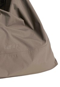 Brown soft fabric with subtle creases and "rethinkit" embossed near a stitched seam on a partially visible item against white background.