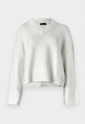Hvit cropped genser med V-hals, ribbestrikket kant og lange ermer. Laget av et mykt, teksturert strikkemateriale. Enkel og allsidig design.
