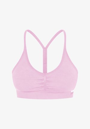 Top di sport rosa chiaro con scollatura a cuore e doppie spalline che formano un design incrociato sul retro. Tessuto morbido con una fascia testurizzata nella parte inferiore.