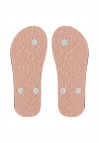 Lyserøde flip-flop såler lavet af tekstureret gummi, med et blomstermotiv og tre hvide knapper til vedhæftning eller udsmykning.