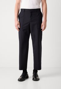 Navy trousers with a straight cut, made of a smooth material. Features two front pockets and a button closure at the waist.