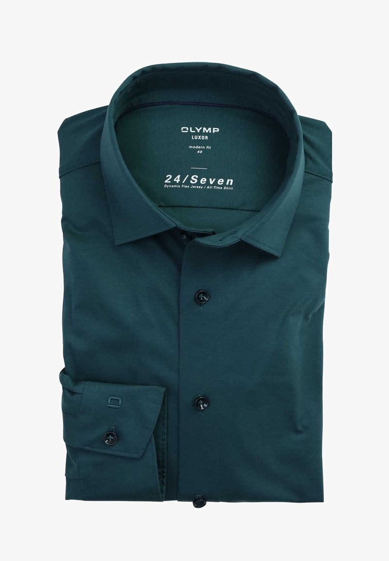 Tummanvihreä, modernin istuvuuden paita. Valmistettu sileästä kankaasta, jossa on nappikiinnitys edessä, taitetut hihansuut ja klassinen kaulus.