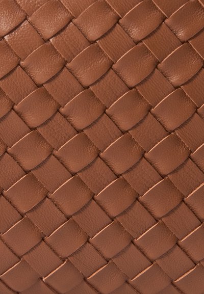 Woven leather material in a warm brown color, featuring a crisscross pattern with smooth, textured accents throughout.