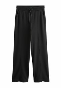 Sorte atletikbukser med vide ben, lavet af blødt stof. Har snøre i taljen og sidelommer, glat tekstur.