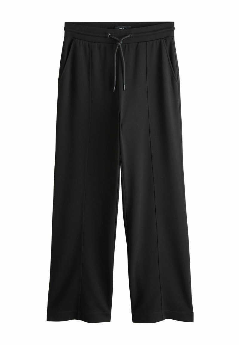 Sorte atletikbukser med vide ben, lavet af blødt stof. Har snøre i taljen og sidelommer, glat tekstur.