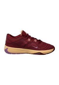Scarpa sportiva rossa con tomaia in tessuto liscio, accenti beige, suola viola e un design snello con un motivo a onda sottile.