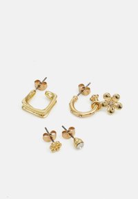 Gold-toned jewelry set includes two hoop earrings, one square-shaped, a flower stud, and a crystal stud. Smooth and polished texture.