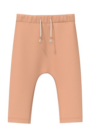 Pfirsichfarbene Shorts mit glatter Textur, elastischem Bund und Kordelzug mit Quasten. Sie verfügen über einen lockeren Schnitt und eine Länge bis zur Mitte der Waden.