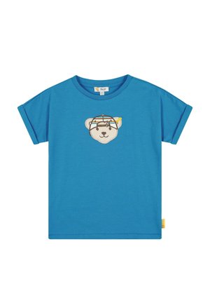 Blaues T-Shirt mit kurzen Ärmeln aus Baumwollstoff, mit einem gestickten Bärenkopf auf der Vorderseite in buntem Design und einem gelben Etikett an der Seite.