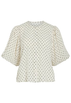 Hvid bluse med sorte polkaprikker, rund halsudskæring, knapper foran og brede, puffede korte ærmer.