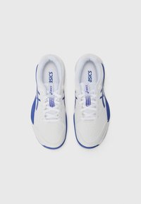 White athletic shoes with blue accents, featuring a textured upper, mesh details, and flat laces. Sturdy rubber sole for support and grip.