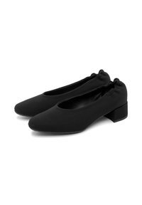 Bailarinas negras con punta redondeada, tobillo elástico y tacón bajo. Fabricadas con un tejido texturizado. Diseño minimalista sin logotipos visibles.