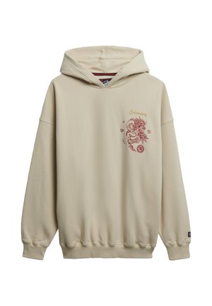 Felpa con cappuccio beige con ricamo di un drago rosso e testo "Superdry" dorato sul petto sinistro, polsini e orlo a costine, e tasca a marsupio frontale.