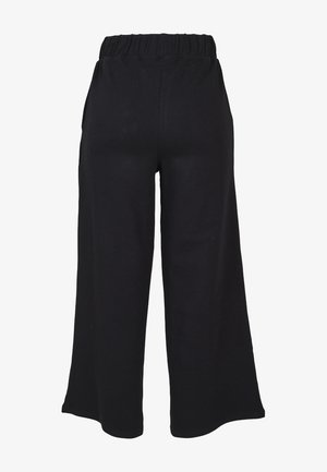 Black, wide-leg pants made from soft fabric with an elastic waistband; features a simple design and no visible hardware or patterns.
