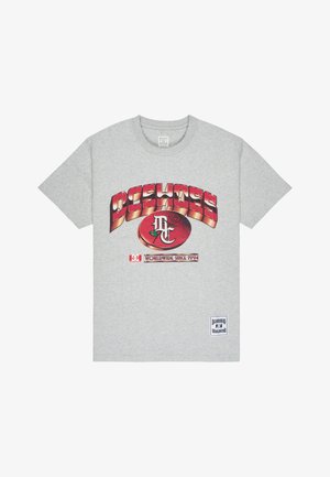 Grey cotton t-shirt featuring bold red and black graphic text "DC SHOE" with a circular logo and rose design. Includes a patch with "Worldwide since 1994."