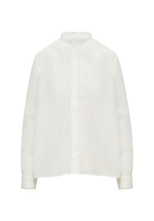 Weiße Bluse mit langen Ärmeln, Rüschenschnitt am Mandarin-Kragen, Knopfverschluss und subtiler Textur. Mit feinen Fältchen an den Ärmeln.