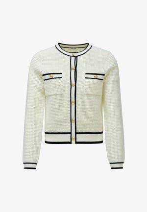 Cárdigan blanco con textura y ribetes negros, que presenta dos bolsillos frontales y botones en tono dorado. Diseñado con un cuello redondo y mangas largas.