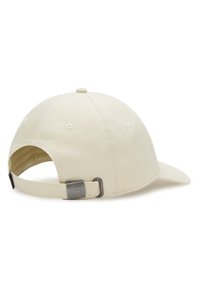 Cream-colored cap with a curved bill, made of cotton. Features a metal adjustable strap at the back with a branded accent.