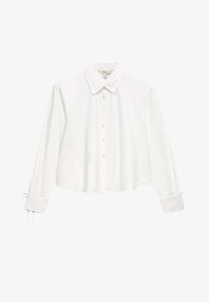 Weiße langärmelige Bluse mit Knöpfen, spitzem Kragen und Bindebändern an den Manschetten, kurzem Saum und glatter Stoffstruktur.